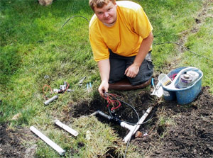 one of our Dickinson sprinkler repair techs is fixing a broken valve