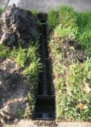 freshly installed drain trench