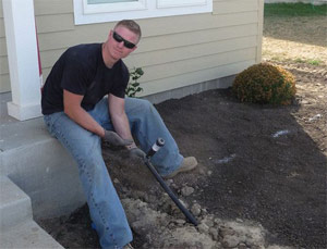 one of our Rosenberg TX sprinkler repair experts is attaching the final sprinkler head