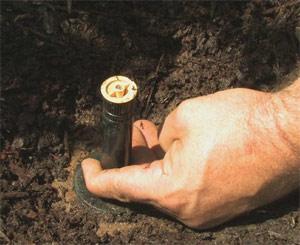 an irrigation expert is installing a new head